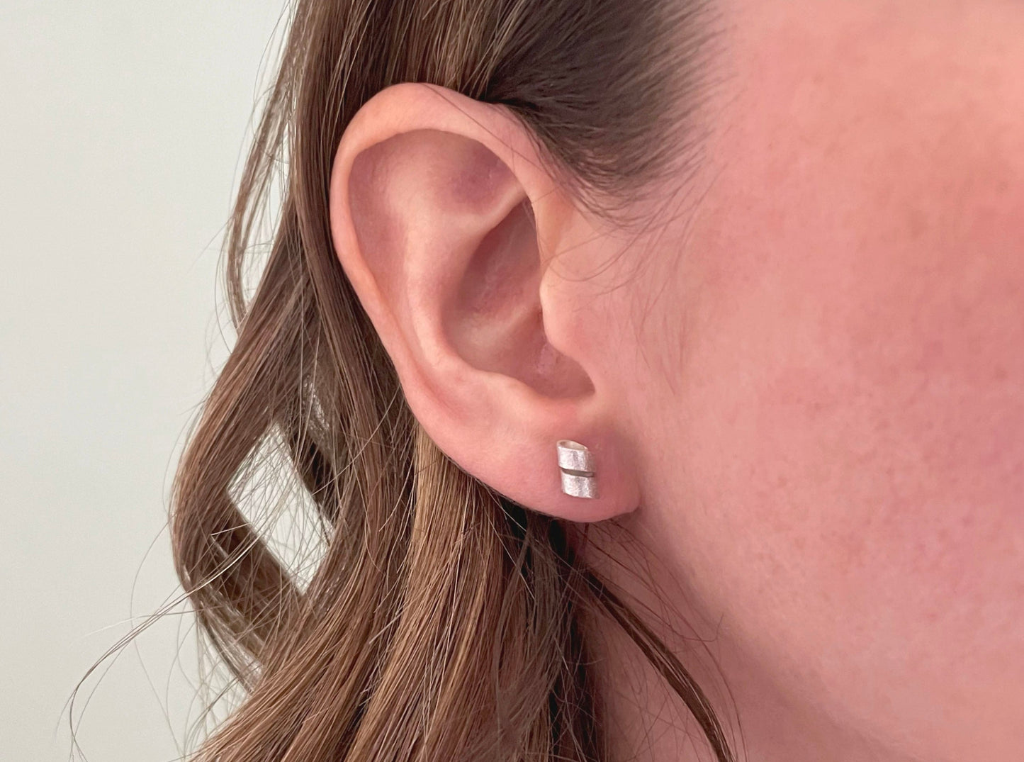 Silver Petal Twist Stud Earrings by Curious Magpie Jewellery